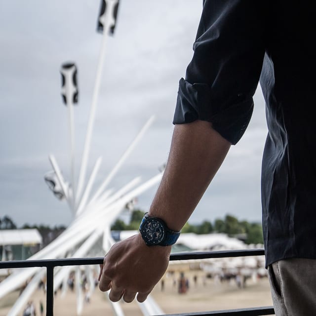 Roger Dubuis watch worn by a man in a lamborghini car