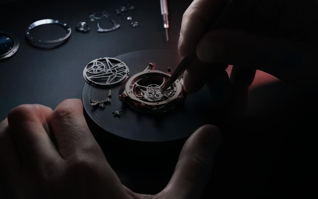 Roger Dubuis watchmaker servicing a timepiece